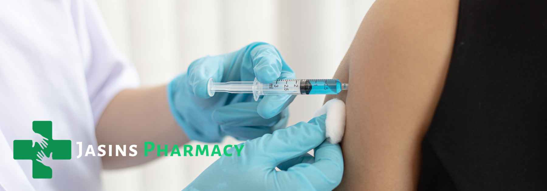 person in black shirt receiving vaccine