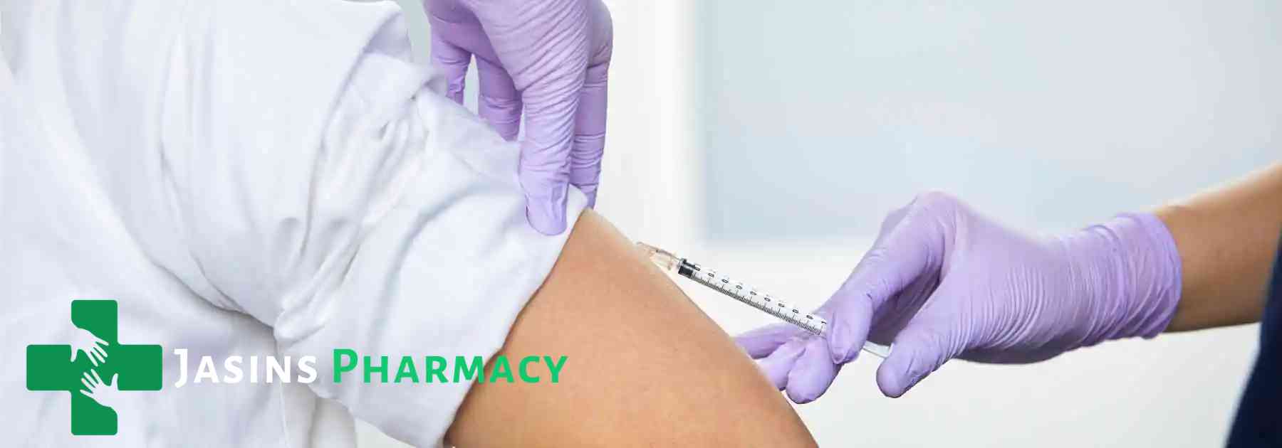 person in white shirt receiving vaccine from medical professional