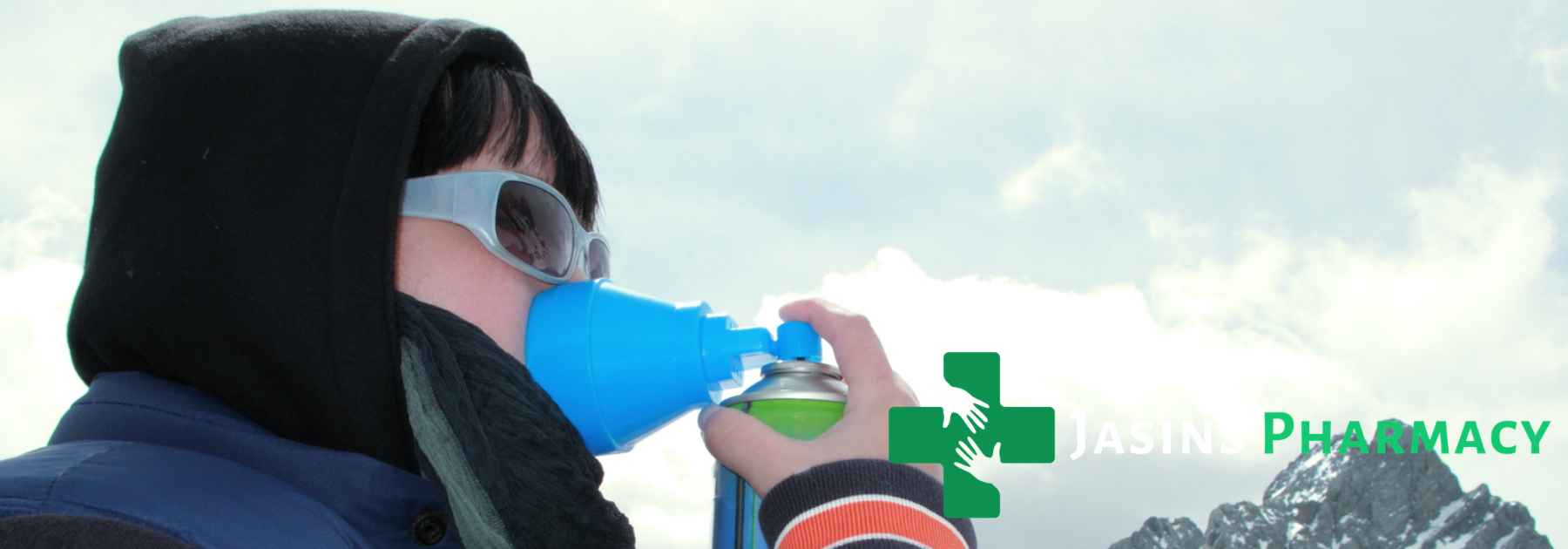 mountain climber using oxygen spray